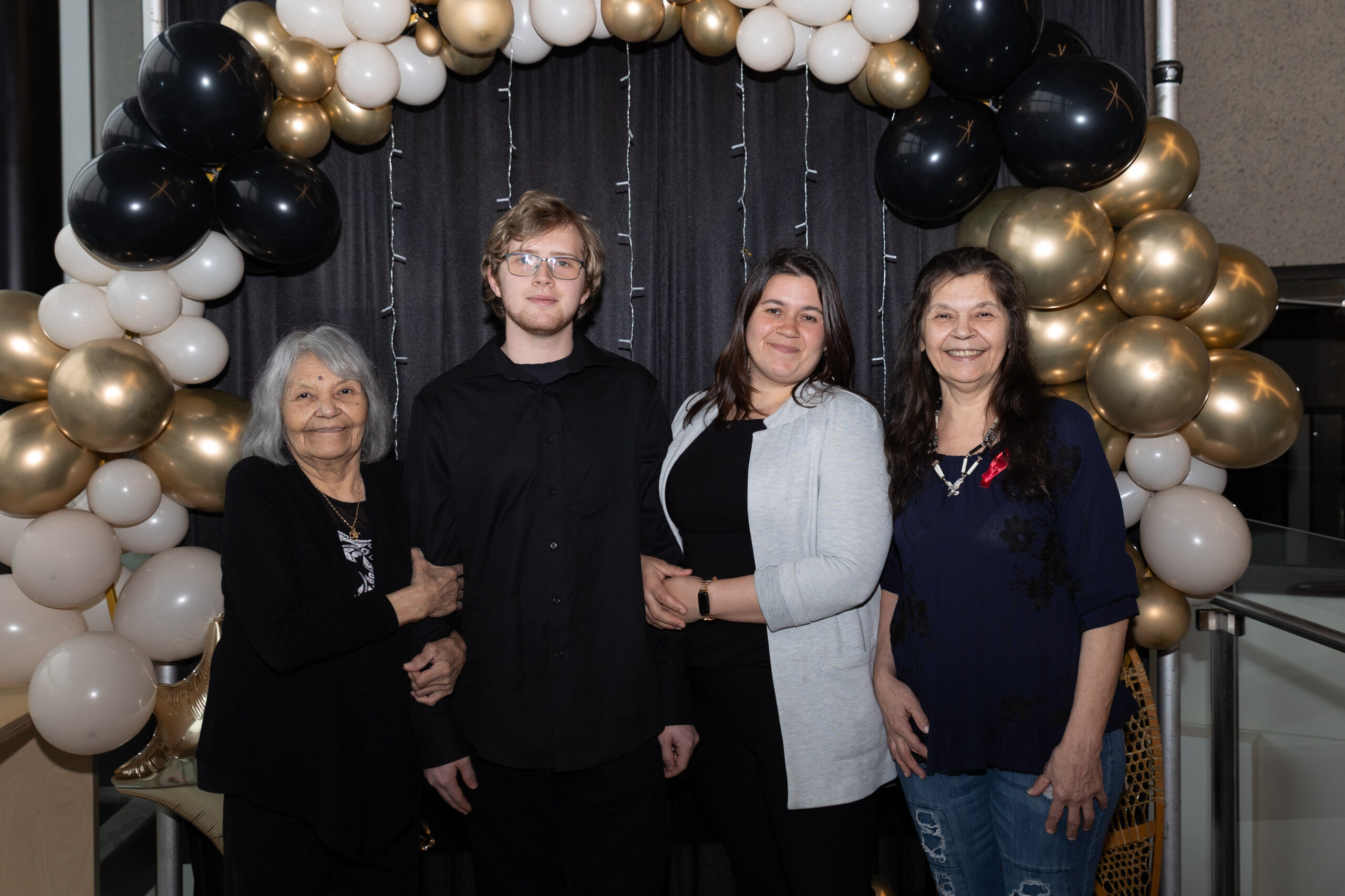 Student Logan Morsillo, accompanied to the gala by his great-grandmother, mother, and grandmother.