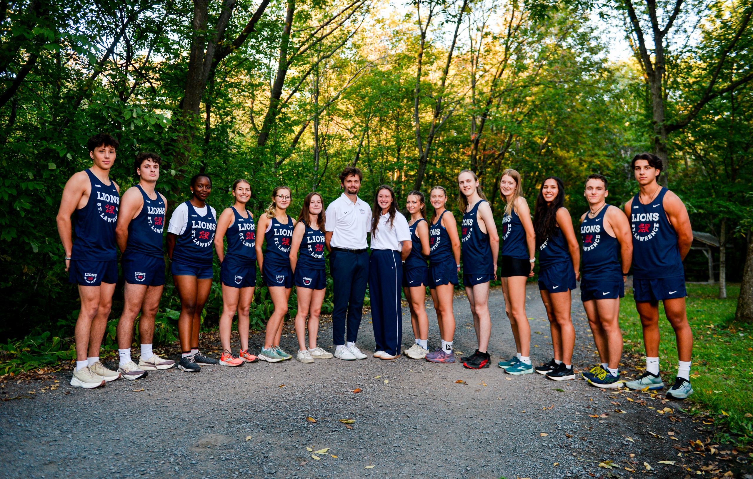 A group of cross country athletes taking a group picture
