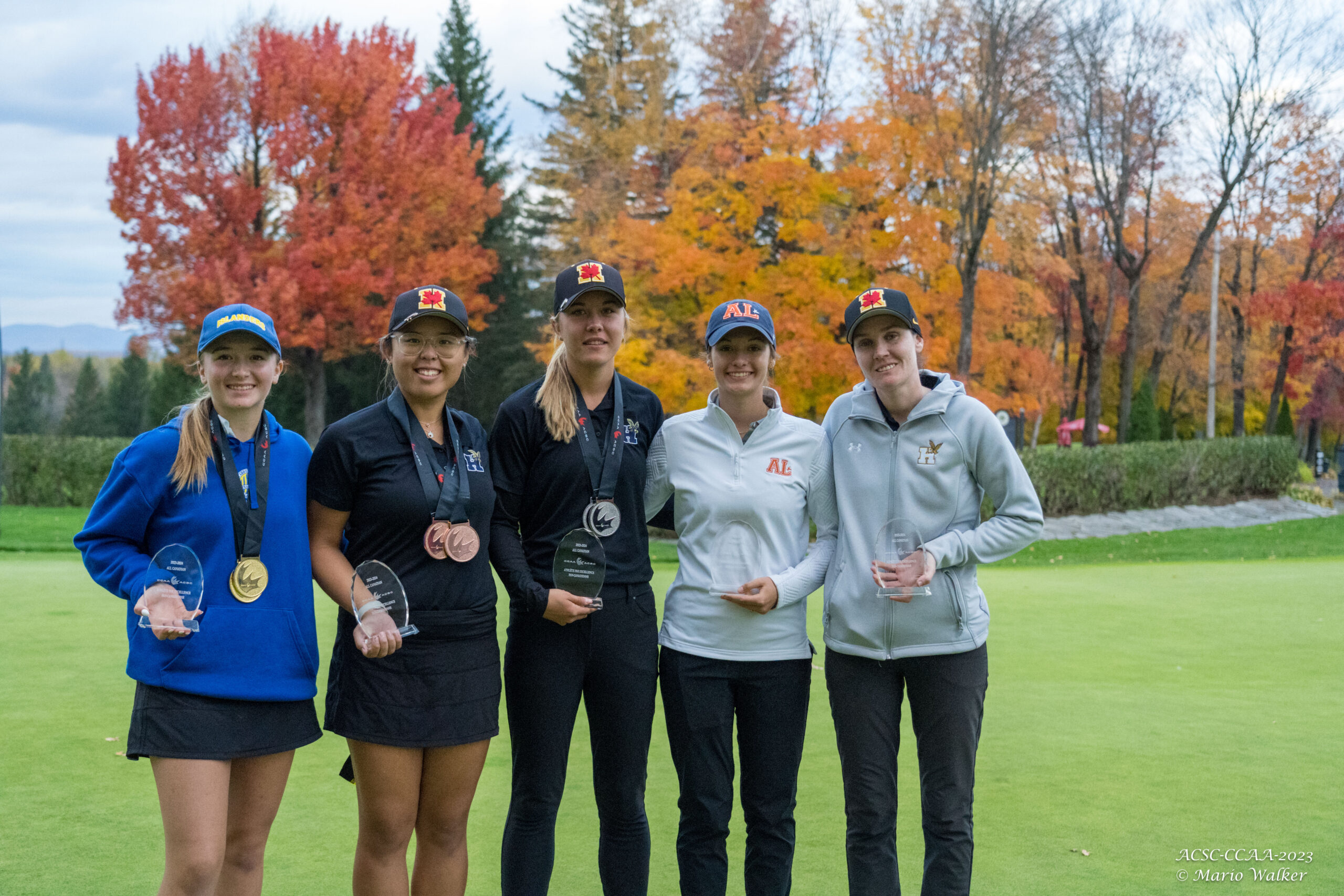 The five women's All-Canadians pose for a photo.