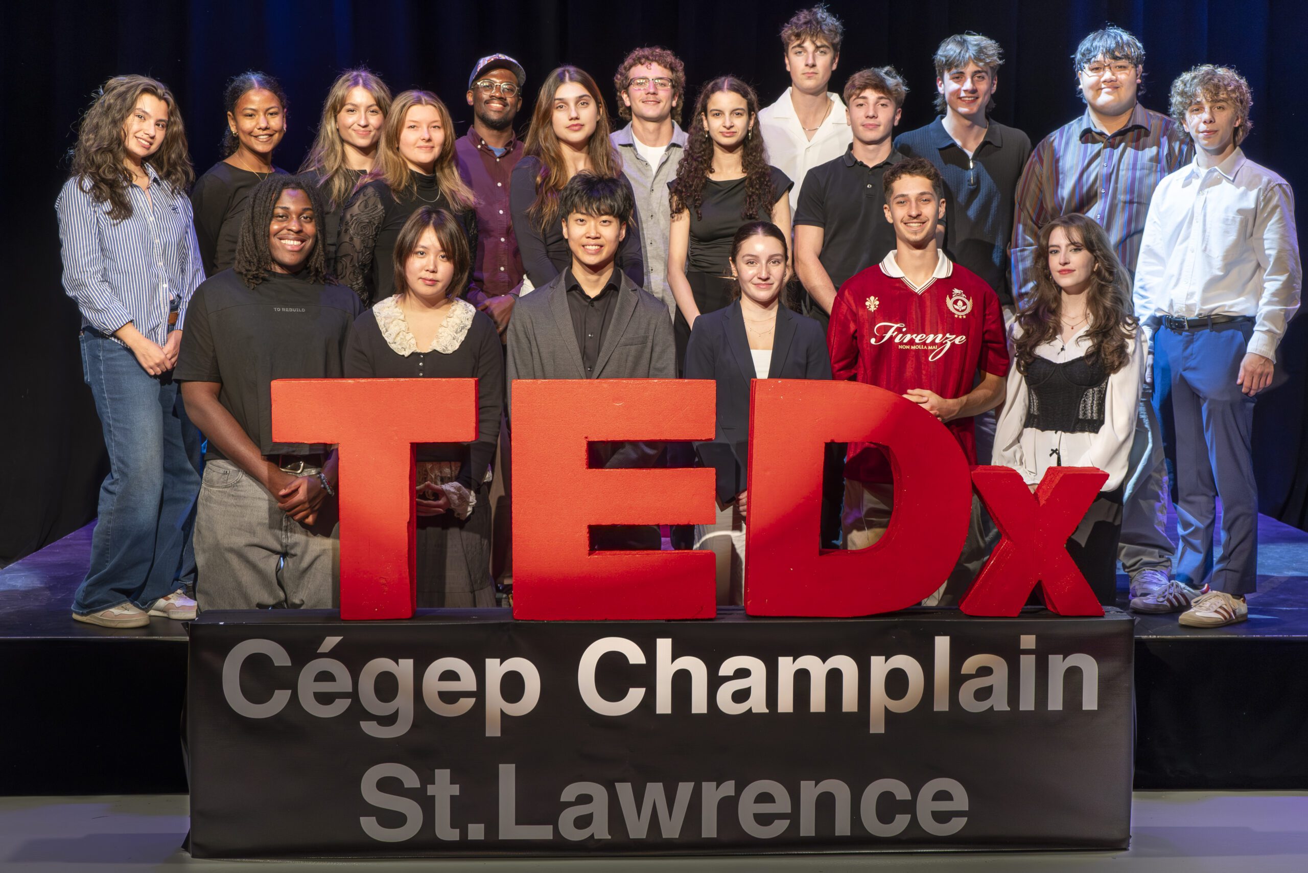 Members of the 2025 TEDx St. Lawrence organizing committee and student speakers pose with the TEDx sign