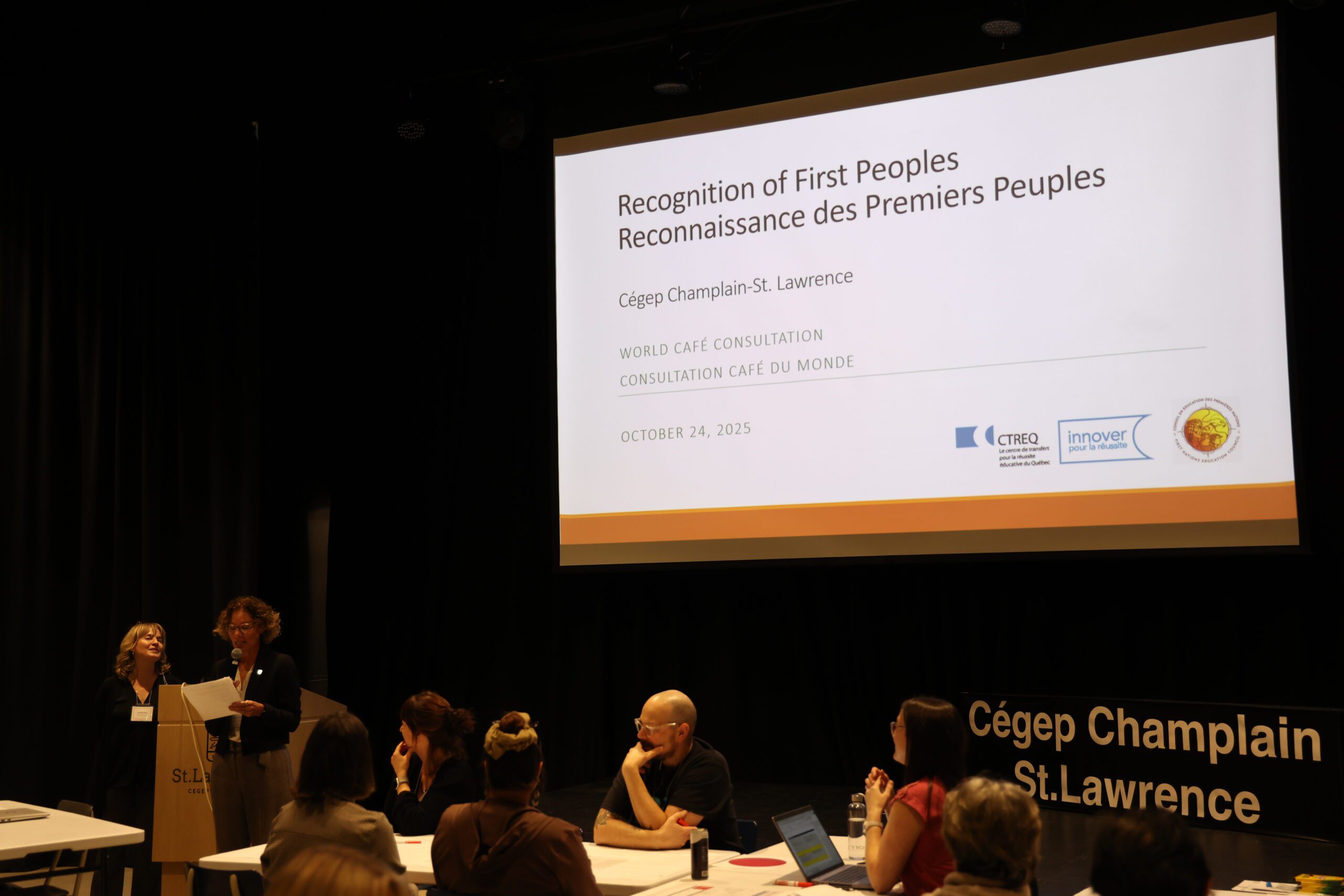 Presentation in front of a slide reading "Recognition of First Peoples"